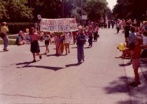 Kids marching in parade for the library